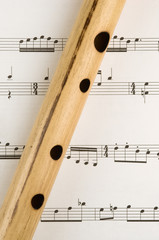 Bamboo flute on sheet music