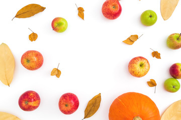 Autumn frame with fall dried leaves, apples and pumpkin on white background. Flat lay, top view