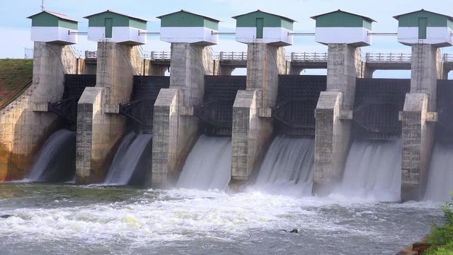 Beautiful view of Meheragala reservoir dam illuminated by sun. Impressive water barrier construction represented on Sri Lankan 5000 rupee banknote. Camera stay still, Yala National Park, Sri Lanka.
