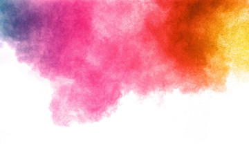 abstract color powder explosion on  white background.Freeze motion of dust splash