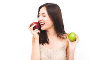 Woman holding and eating fresh red and green apple on white background.dieting concept.healthy...