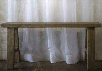 Fototapeta na wymiar Warm cozy room with wooden bench