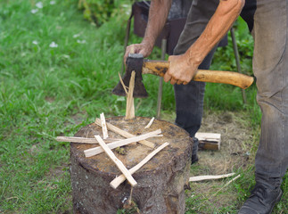 Fototapeta premium man chopping splinters