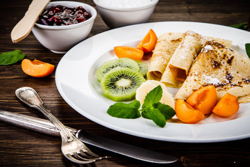 Crepes with fruits and creme 
