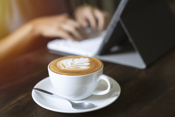Hipster asian woman typing on tablet in the cafe with sunlight, lifestyle concept