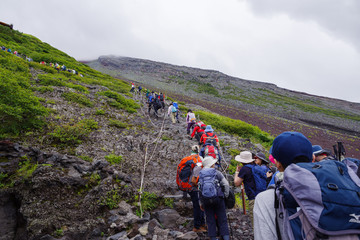 Making Line by Alpinists up to the Summit of the Mt. Fuji in Japan