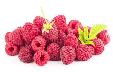 Raspberry with leaves isolated on white background