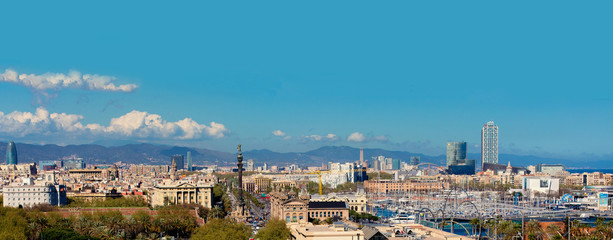 Aerial Panorama view of Barcelona city skyline over Passeig de Colom or Columbus avenue and Port Vell marina