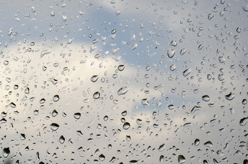morning rain, drops of water on a window glass background, copy space