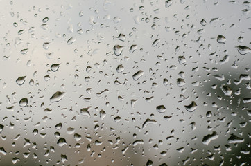 morning rain, drops of water on a window glass background, copy space