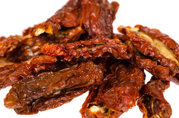 Sun dried red tomatoes isolated on white background