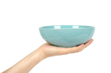 Blue empty ceramic bowl with hand isolated on white background