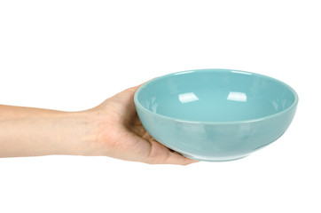 Blue empty ceramic bowl with hand isolated on white background