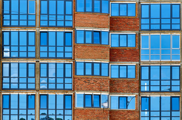 modern blue glass windows wall of office building