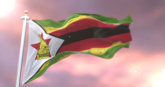 Zimbabwe flag waving at wind in slow at sunset, loop