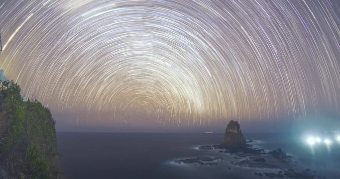 Papuma beach night sky star trail time lapse video clip, Indonesia
