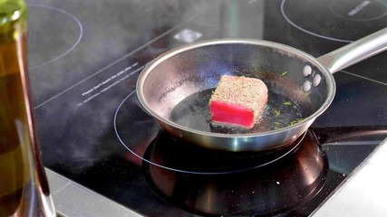 Pan-fried fish, The marlin fillet on the steaming frying pan.
