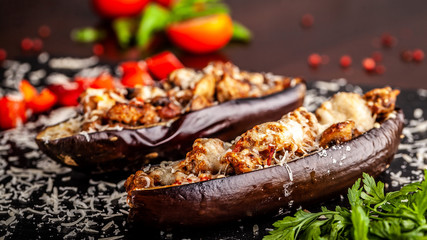 Portuguese cuisine. Baked eggplants with mushrooms, meat, vegetables and parmesan cheese. Copy space, selective focus