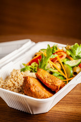 Concept of vegetarian and healthy eating. Cutlets from peas, salad, ogretsami, tomatoes, olives and porridge in eco-box of food starch. self-destructive dishes. Copy space, selective focus