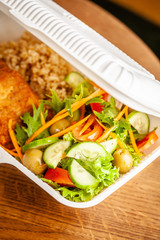 Concept of vegetarian and healthy eating. Cutlets from peas, salad, ogretsami, tomatoes, olives and porridge in eco-box of food starch. self-destructive dishes. Copy space, selective focus