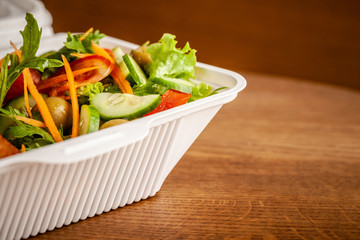 Concept of vegetarian and healthy eating. Cutlets from peas, salad, ogretsami, tomatoes, olives and porridge in eco-box of food starch. self-destructive dishes. Copy space, selective focus