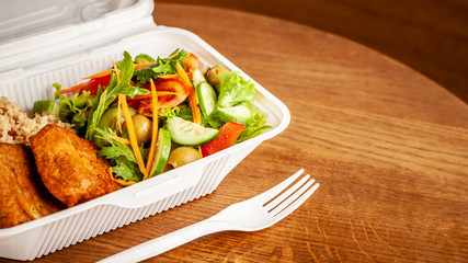 Concept of vegetarian and healthy eating. Cutlets from peas, salad, ogretsami, tomatoes, olives and porridge in eco-box of food starch. self-destructive dishes. Copy space, selective focus
