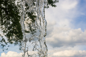 transparent falling water vertical flows, close up