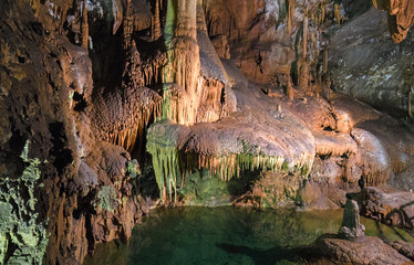 Rock formations of stalactites and stalagmites inside the cave of 