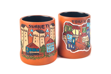 Georgian clay pottery with traditional ornaments on it. White background