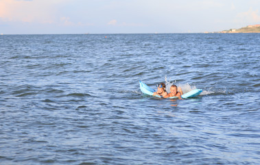 Two children in the sea