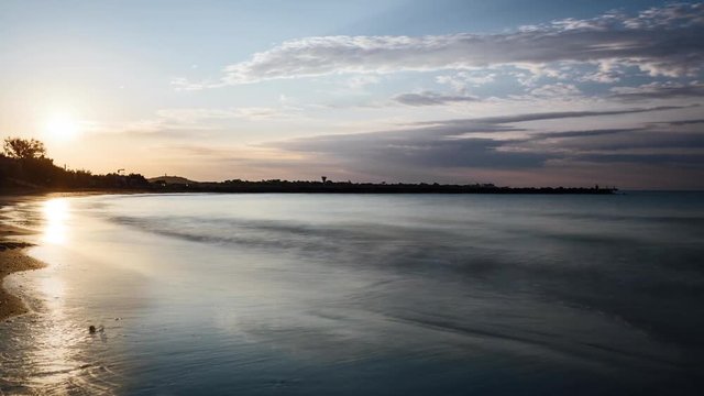 Time lapse of sunrise over a beach on the mediterranean sea, southern France.