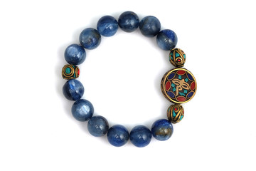 Kyanite or Cyanite blue lucky stone bracelet bead decorate with Chakra amulet accessories on white isolated background
