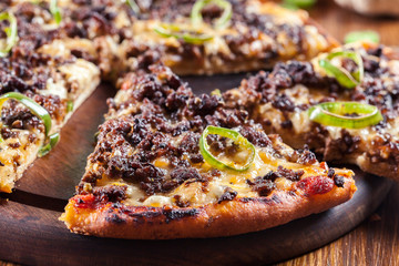 Spicy pizza with minced meat and jalopeno