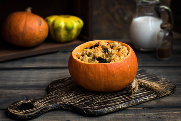 Millet porridge with raisins in pumpkin