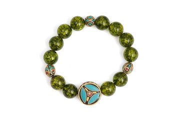 Peridot bracelet Beads green ore lucky stone decorate whit Chakra amulet white white isolated background