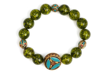 Peridot bracelet Beads green ore lucky stone decorate whit Chakra amulet white white isolated background