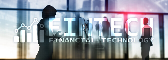 FINTECH - Financial technology, global business and information Internet communication technology. Skyscrapers background. Hi-tech business concept.
