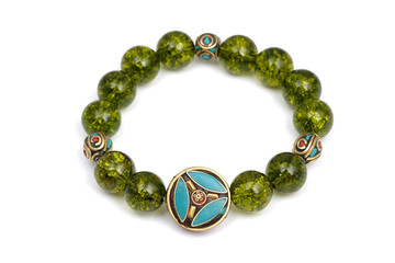 Peridot bracelet Beads green ore lucky stone decorate whit Chakra amulet white white isolated background