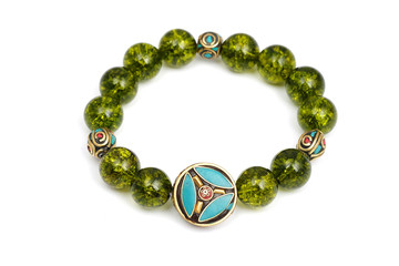 Peridot bracelet Beads green ore lucky stone decorate whit Chakra amulet white white isolated background