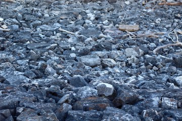 A close view of the rocks and stone of the pile.