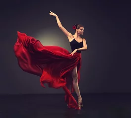 Printed roller blinds Dance School Ballerina. Young graceful woman ballet dancer, dressed in professional outfit, shoes and red weightless skirt is demonstrating dancing skill.   Beauty of classic ballet dance.   