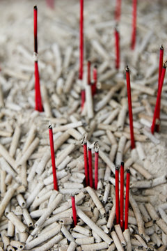 Red burned incents on a temple for praying to the gods