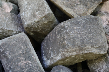 Fototapeta na wymiar Pile of large gray cobblestones for landscape design 