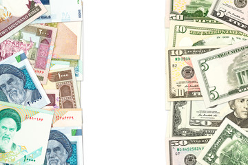 iranian rial and american dollar banknotes indicating bilateral economic relations
