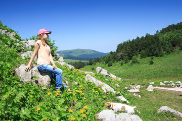 Fototapeta na wymiar teen girl on a hike in the mountains