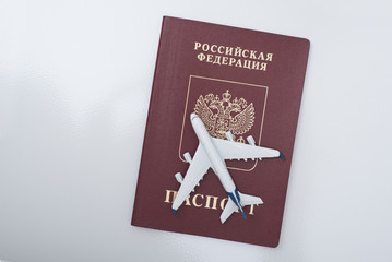 Airplane on the russian passport. Travel concept. White background