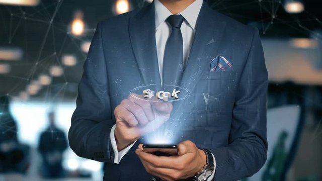 Businessman With Mobile Phone Opens Hologram HUD Interface and Touches Word - STOCK