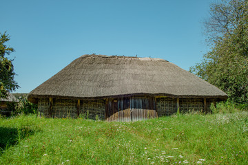 Fototapeta na wymiar Traditional Ukrainian ancient wooden barn or shed