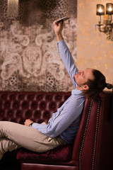 man sitting on the couch in the room