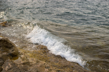 Sea waves on the shore of the beach.